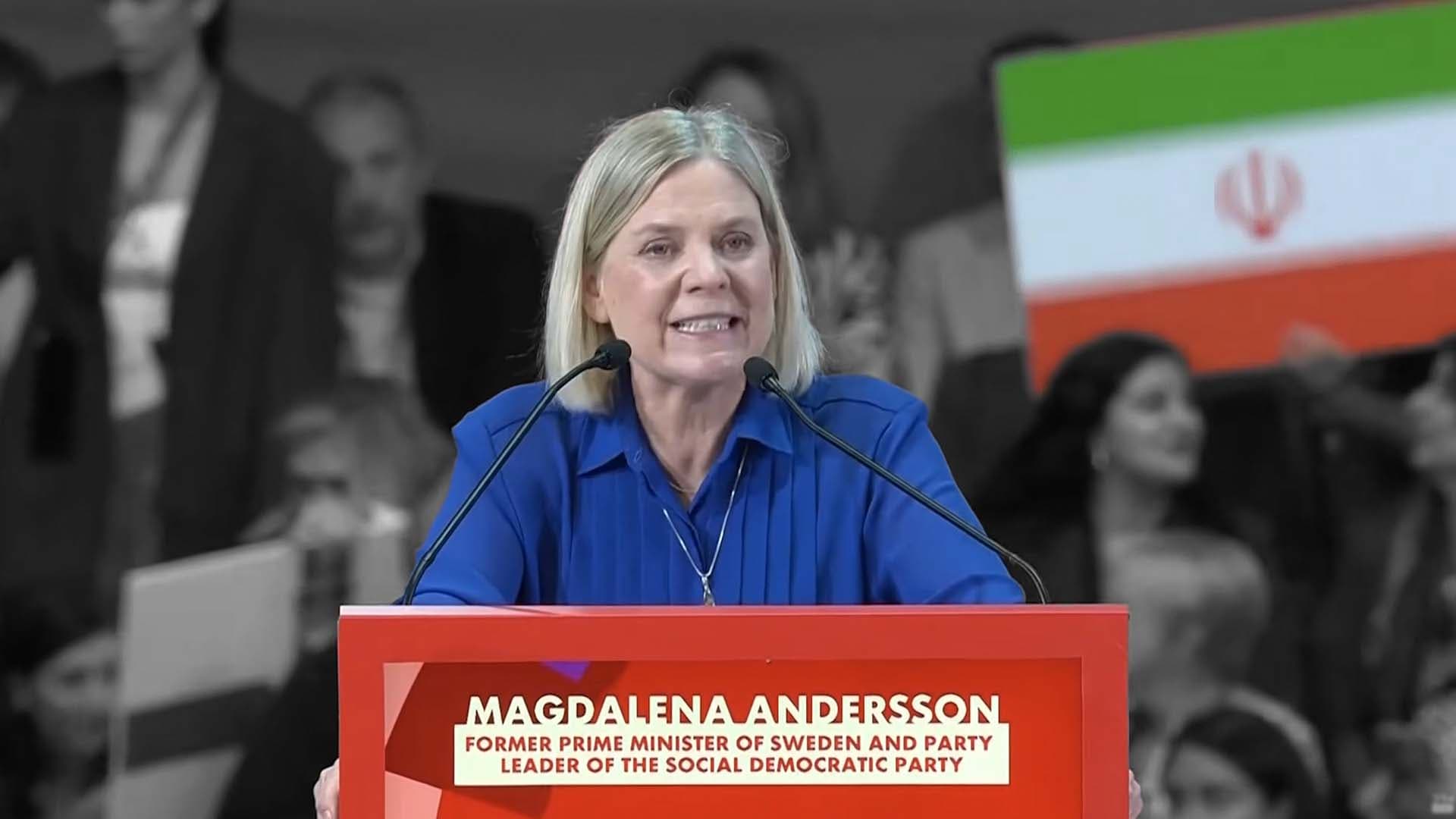 Magdalena Andersson framför Iran-flaggan